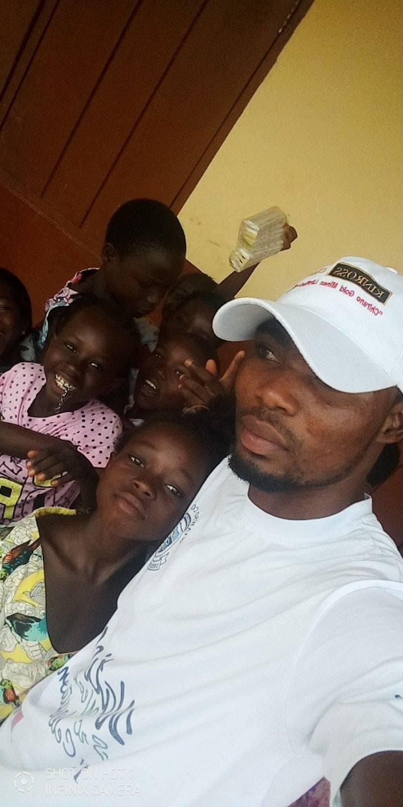 Richard surrounded by community children